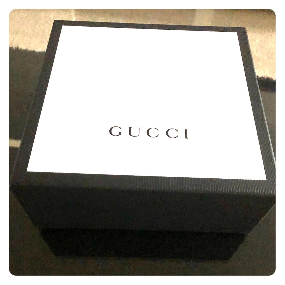 Gucci box and dust bag.